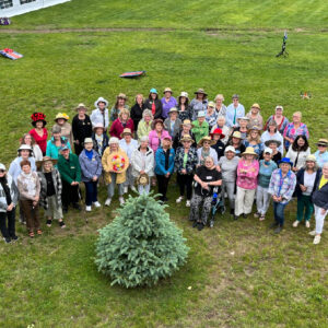Large group of women from CFUW Orillia around a tree