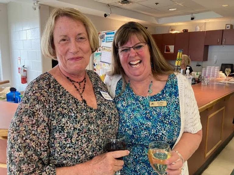 A couple of women smiling