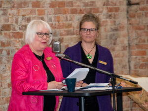 Two speakers at a podium